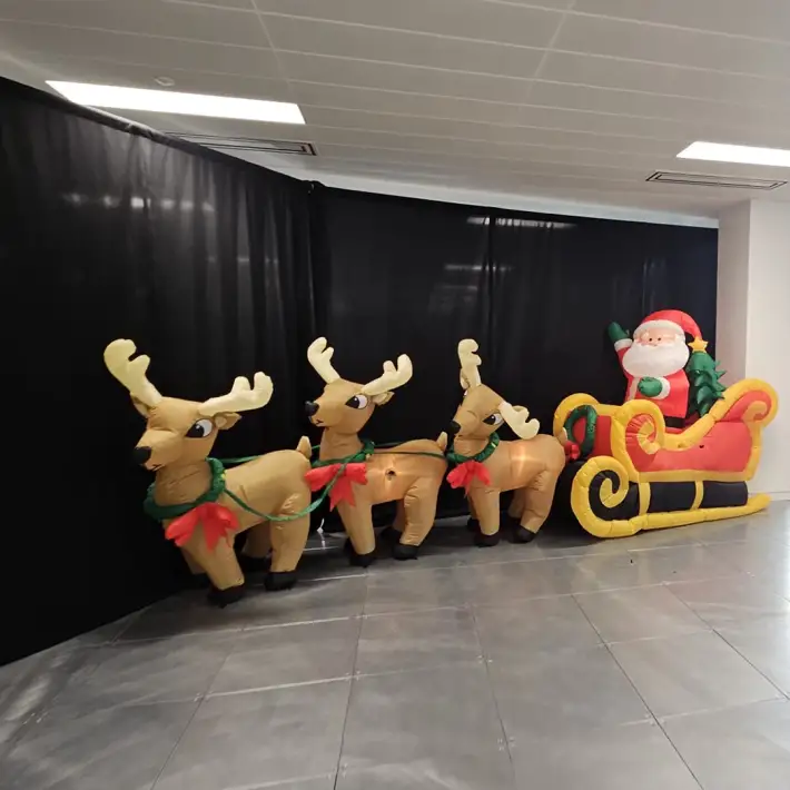 Inflatable Santa sleigh with reindeer at a corporate office kids Christmas party in Dublin.